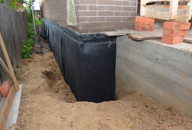 Happy homeowners after waterproofing job in Ovid